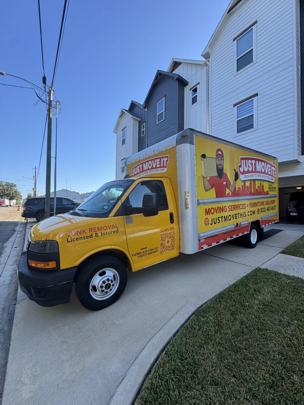 Just Move It truck parked at a Houston townhome for delivery